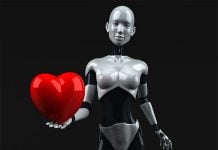 Roboter mit rotem Herz in der Hand